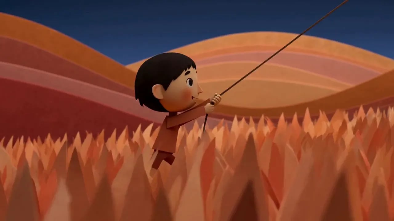 A papercut boy holds a kite string in tall paper grass beneath rolling orange hills.